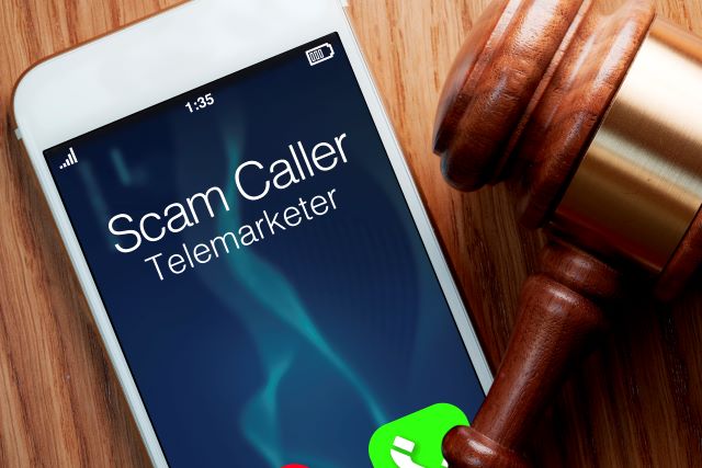 Debt collection scammer incoming call appearing on smartphone screen