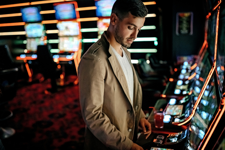 Man altering the outcome of a slot machine